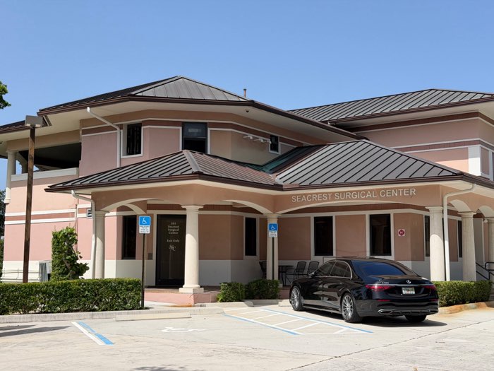 Pink stucco medical building with a covered entrance on Seacrest Boulevard, Boynton Beach